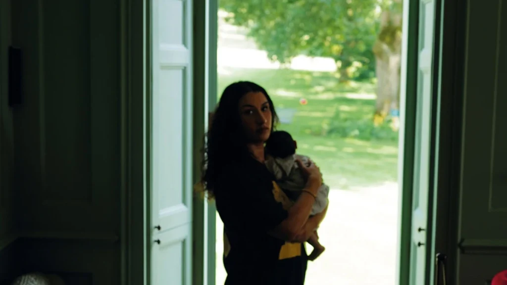 Cover artwork for Gentlewoman showing a woman holding a child in a doorway