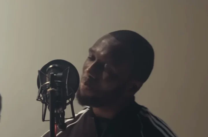 Headie One recording at a studio microphone