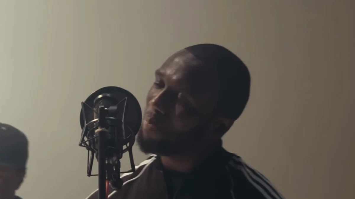Headie One recording at a studio microphone