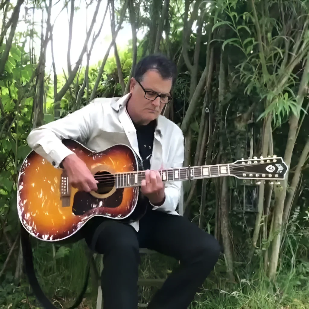 Ian Roland Plays a Twelve-String, and the Line Runs Back to Lead Belly