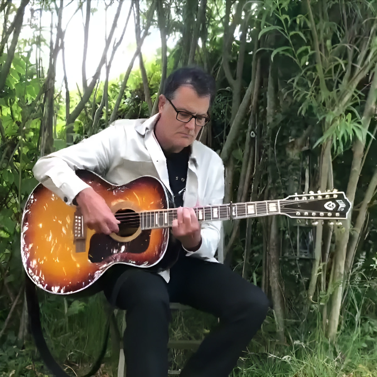 Ian Roland Plays a Twelve-String, and the Line Runs Back to Lead Belly